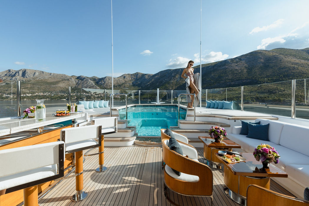 elegant aft deck seating area aboard Aquila with panoramic Mediterranean views