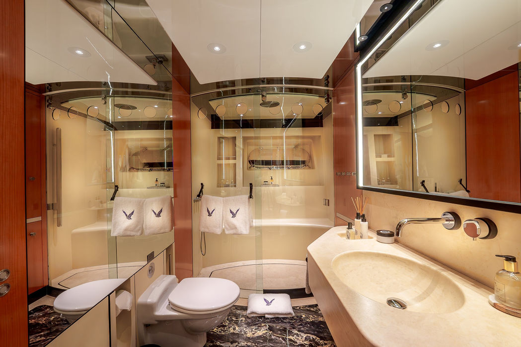 Master bathroom aboard the Maltese Falcon with large vanity and marble details.