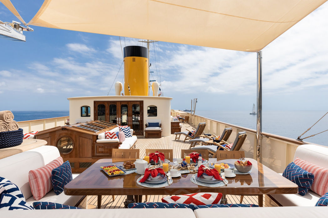 Upper deck bar and shaded seating overlooking the sea on Nero superyacht