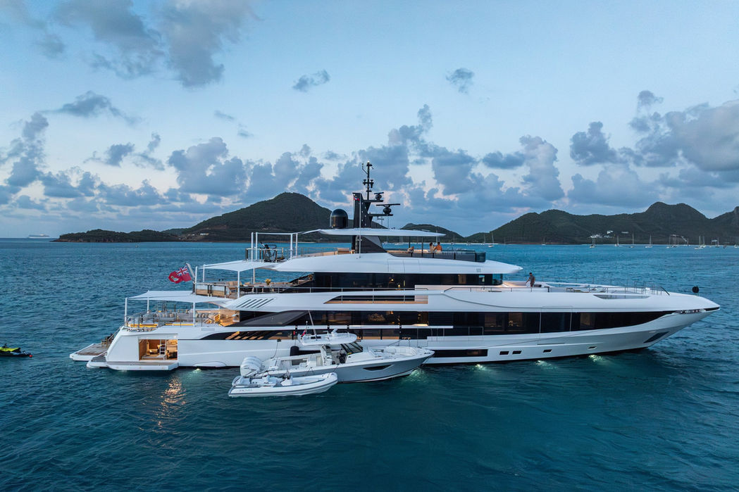 Luxury yacht Dokinha cruising in the Mediterranean with island backdrop