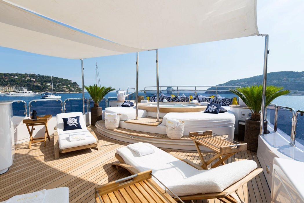 Aft seating terrace aboard M/Y Bina with panoramic Mediterranean views