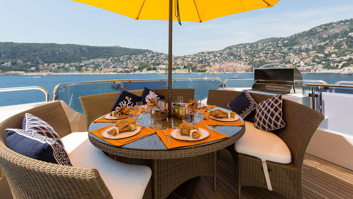 Breakfast table set on M/Y Bina’s deck overlooking the French Riviera