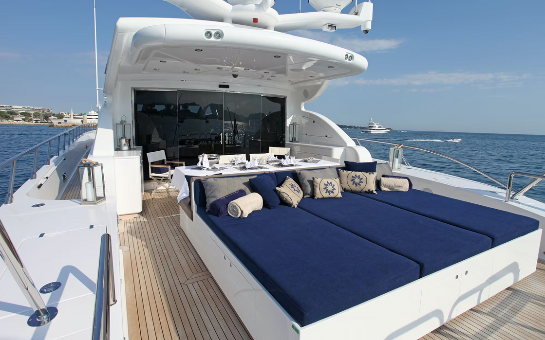 Large sunpad area and swim platform on Phoenician yacht overlooking Mediterranean water