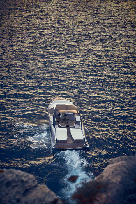 aerial view of frauscher 1414 demon air underway showing modern hull lines and wide swim platform