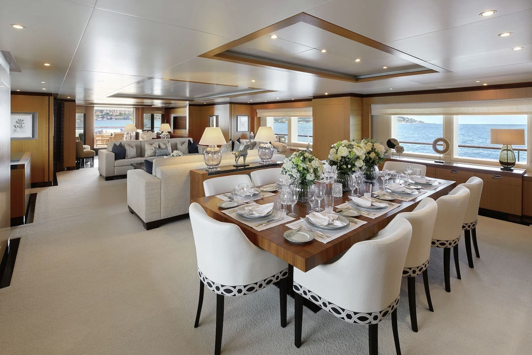Formal dining area onboard MIMI superyacht during a luxury charter with Navélia Yacht Charters