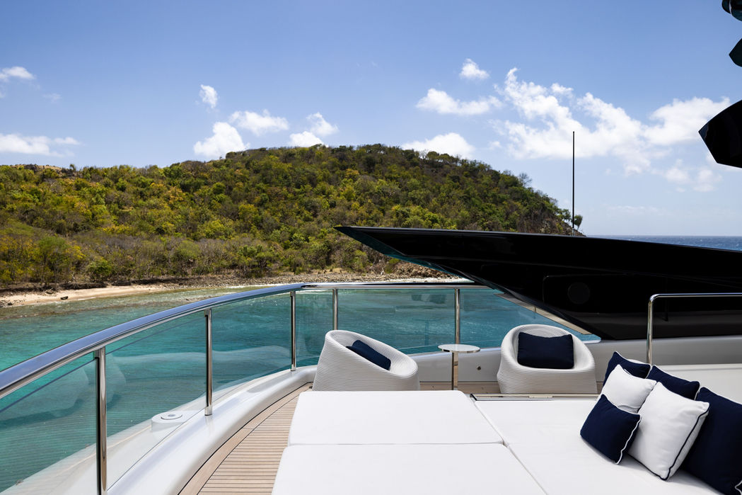 Forward lounging area on Resilience superyacht with panoramic views, chartered by Navélia Yacht Charter St Tropez