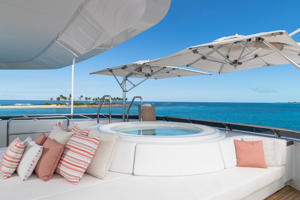 Sun loungers and shade umbrellas on Santosha yacht’s upper deck