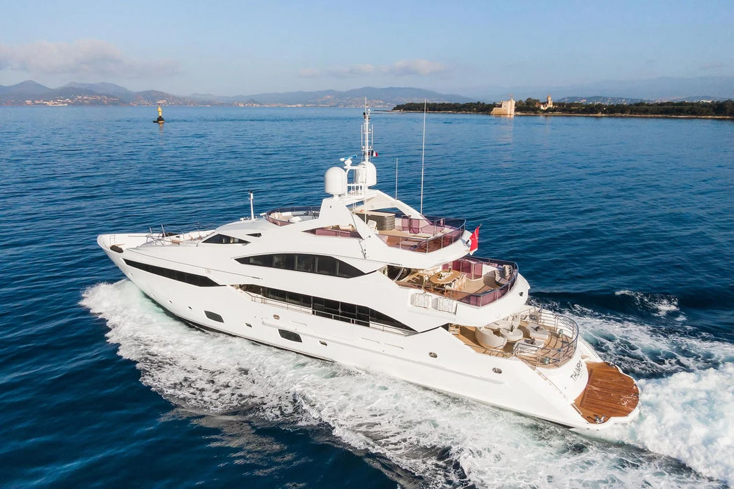 Thumper 40m Sunseeker superyacht cruising through the Mediterranean with sleek white profile.