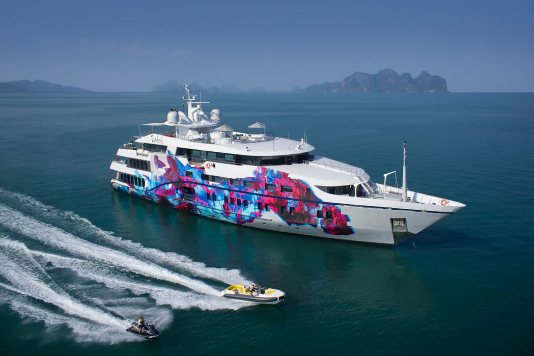 Aerial view of Saluzi superyacht cruising at high speed along the coastline.