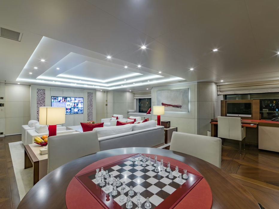 Elegant indoor dining space aboard Roma superyacht, designed for luxury charters.