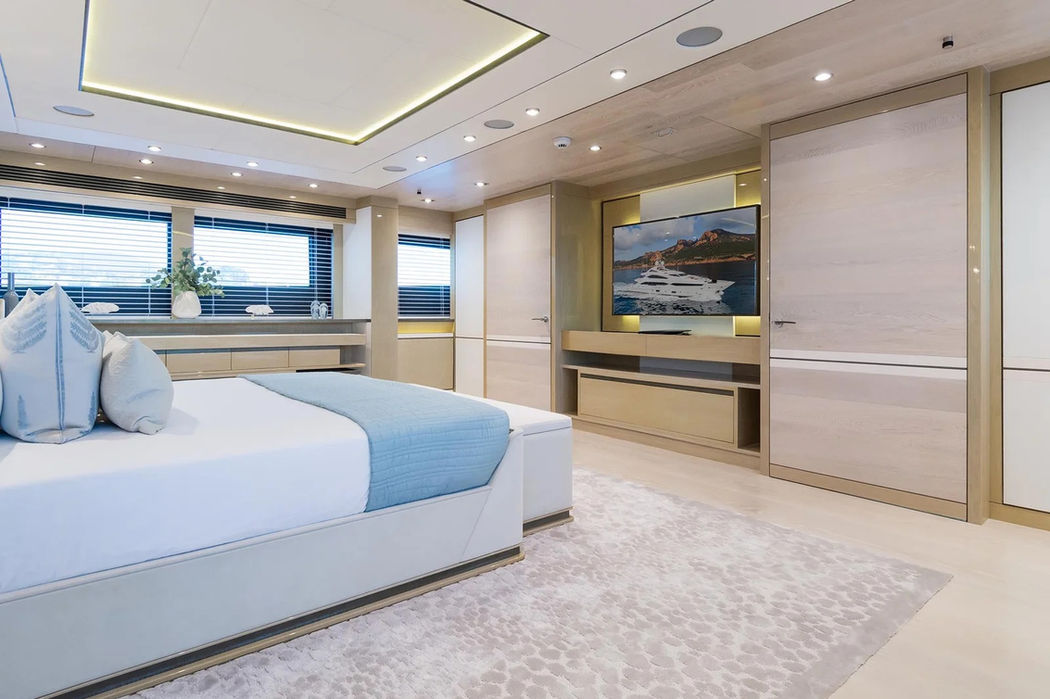 Guest cabin aboard Thumper with twin beds and a refined modern interior.