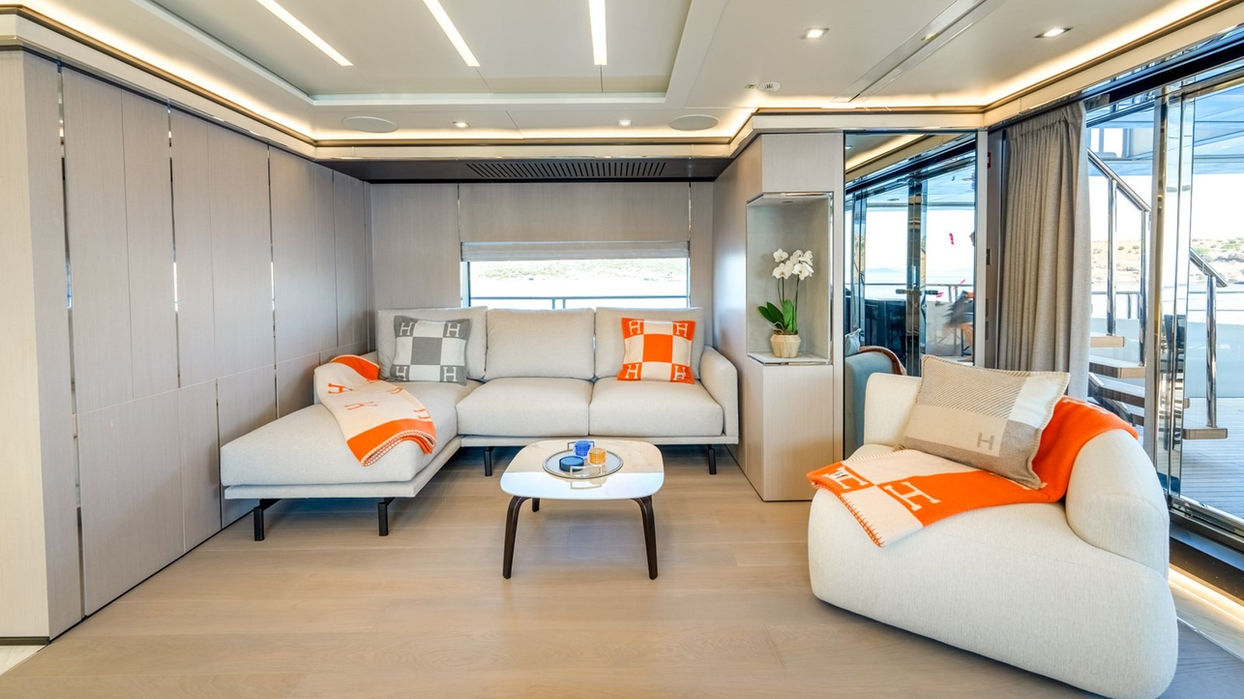 Bright and modern main salon lounge on the Provocateur superyacht, featuring panoramic windows and luxury seating ideal for charters in Monaco and Saint-Tropez.