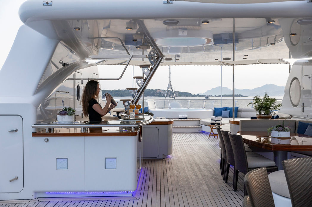 Luxury yacht Talisman Maiton al fresco dining area, shaded lounge, yacht lifestyle