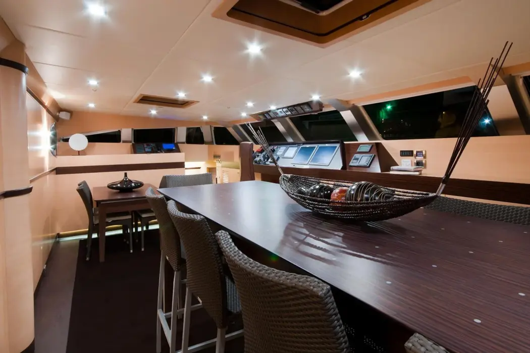 Aft dining and lounge area on Ipharra sailing yacht with open Mediterranean views