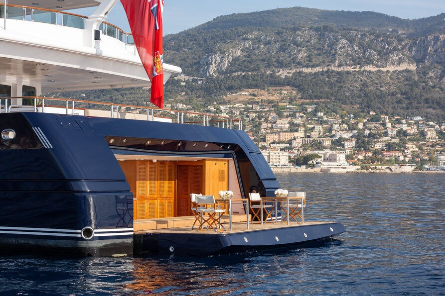 Stern view of Treehouse luxury superyacht with evening lighting during a Saint Tropez charter with Navélia Yacht Charters