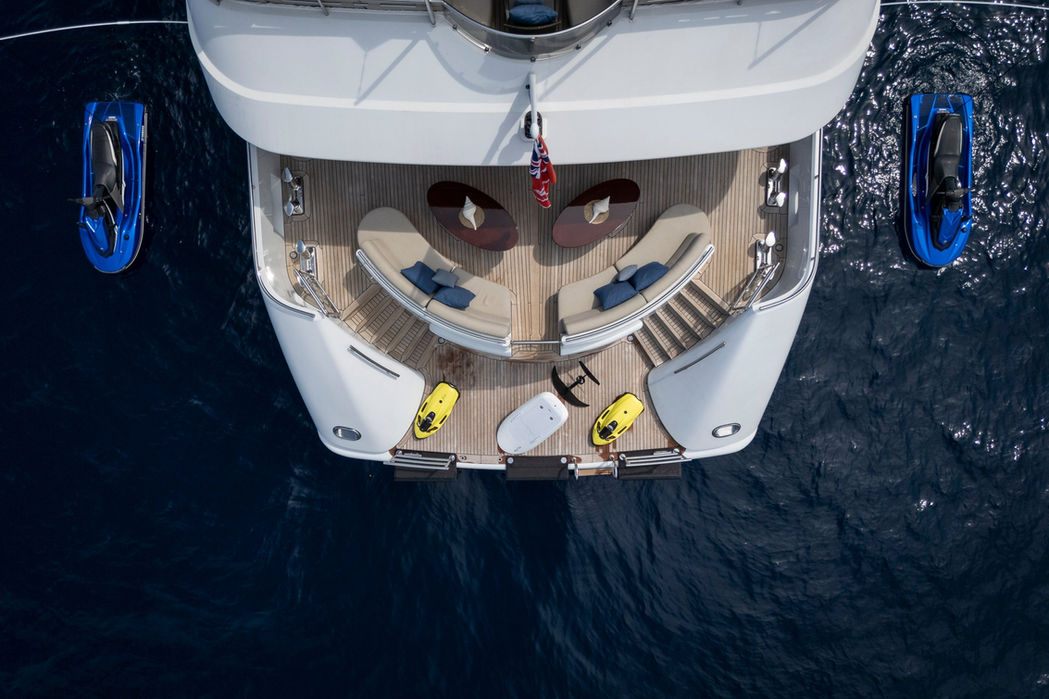 Luxury yacht Talisman Maiton swim platform with water toys, teak deck, charter amenities