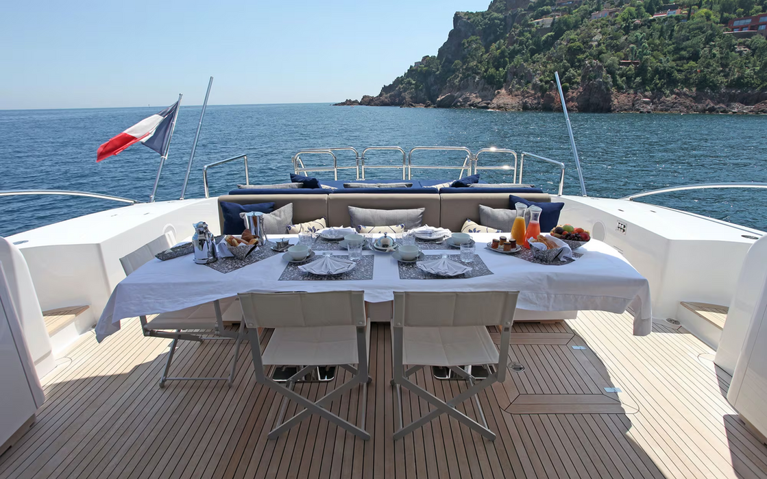 Aft dining table on Phoenician yacht set for outdoor meals on the French Riviera