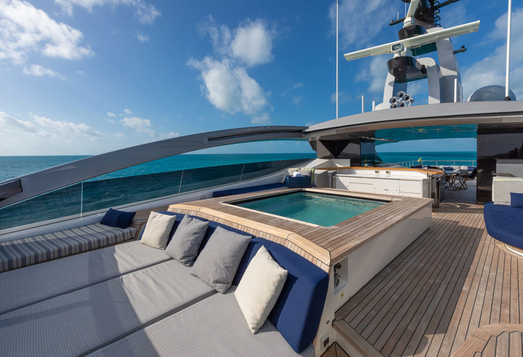 Sundeck seating area on M/Y HALO superyacht with panoramic views and Navélia Yacht Charters service