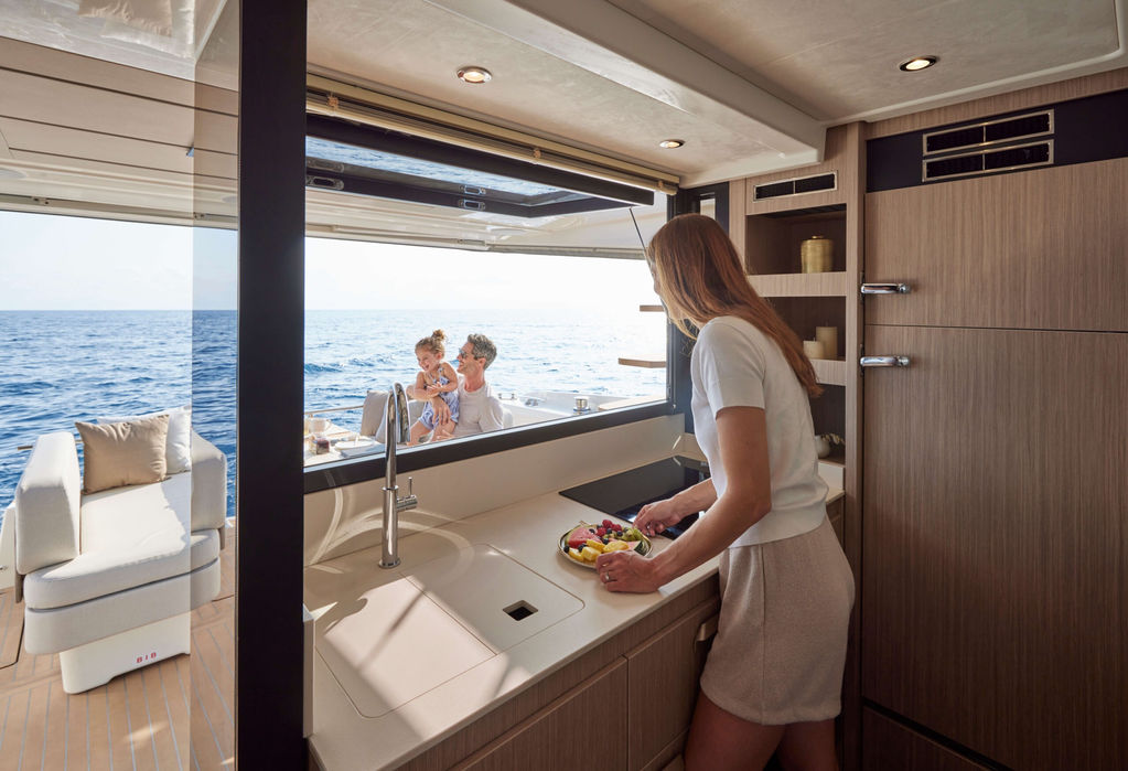 Saloon seating with panoramic windows on the Prestige F4.9 luxury yacht with Navélia Yacht Charters