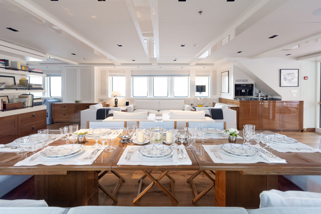 Elegant dining room with banquet-style table on Blue II