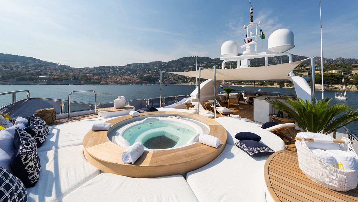 Jacuzzi and sun loungers on the sundeck of M/Y Bina overlooking the French Riviera