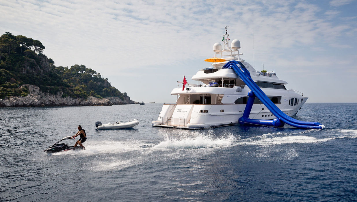 M/Y Bina superyacht with inflatable slide and jet ski in use on the Mediterranean