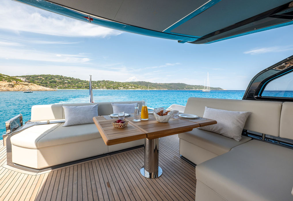 Aft lounge area on Sunseeker Predator 65 with shaded seating