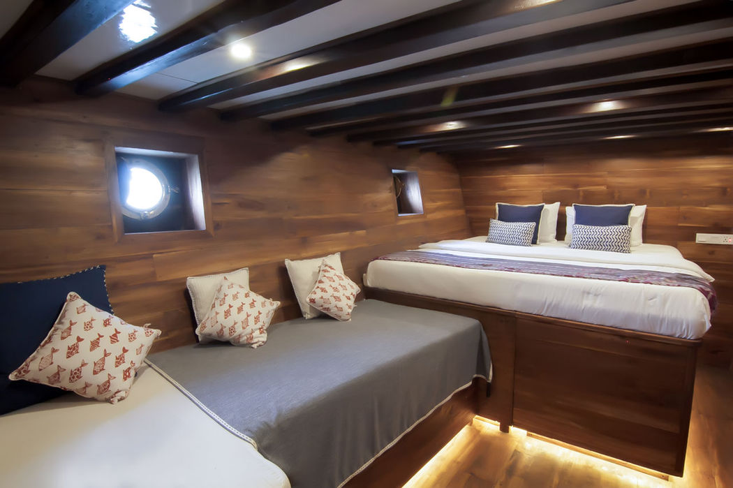 Cabin lighting detail onboard Tiger Blue Phinisi luxury yacht in Komodo with Navélia Yacht Charters Indonesia.