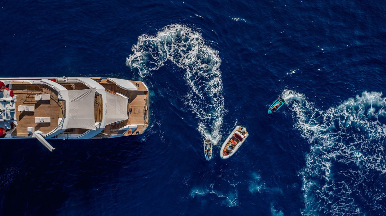 Aerial shot of M/Y JoyMe launching tenders and water toys on the Mediterranean