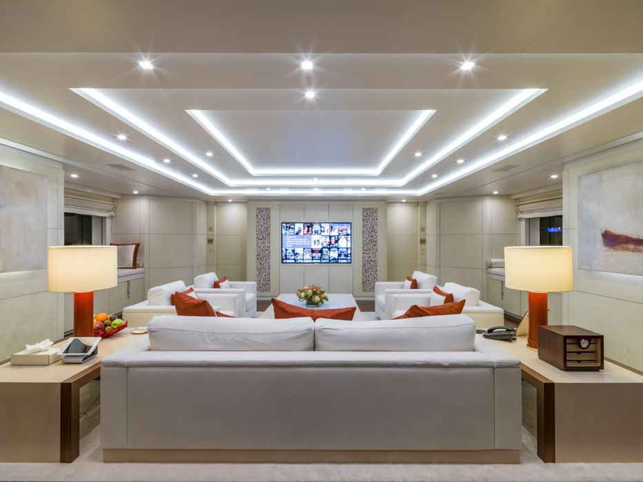 Spacious main salon with panoramic windows aboard Roma superyacht.