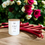 Thumbnail: Rhubarb & Rose candle on table with fresh rhubarb and roses in background