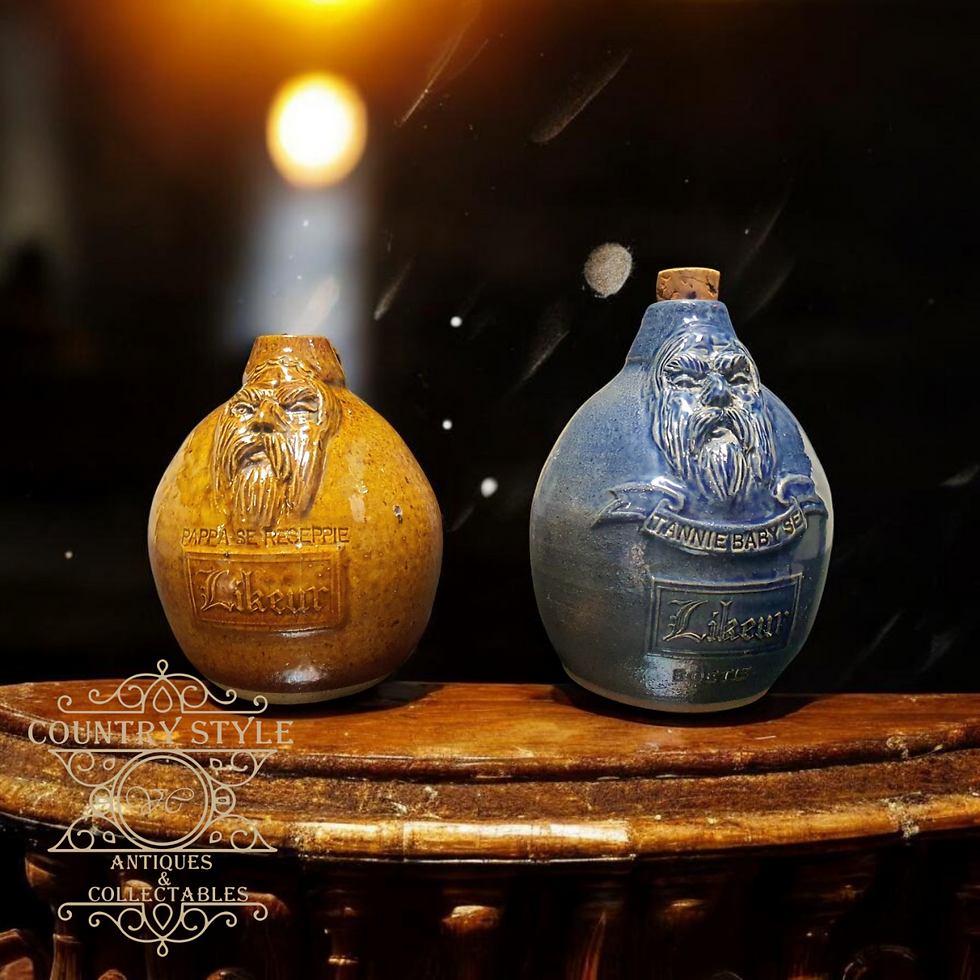Thumbnail: A pair of vintage South African studio pottery character jugs