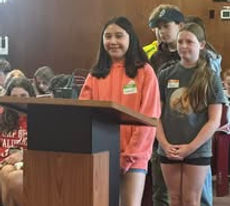 Student in Napa city hall standing at a podium