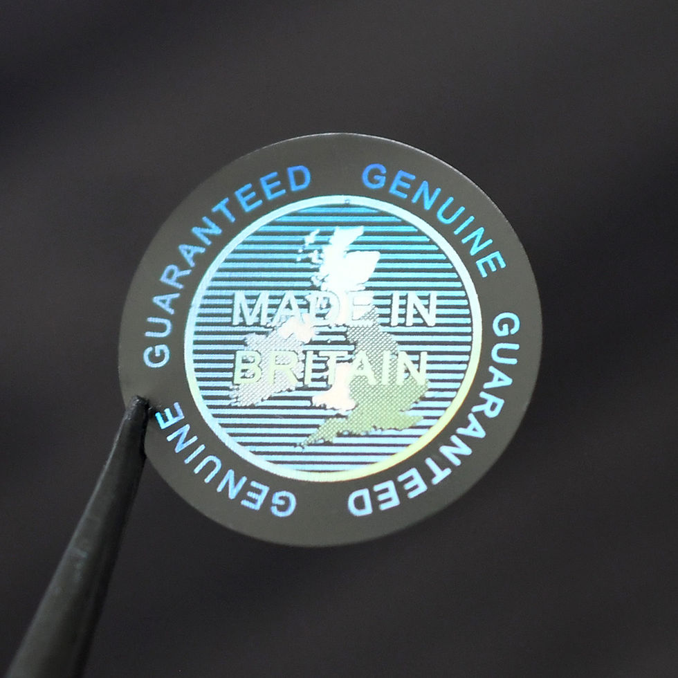 Thumbnail: Holographic 'made in Britain' tamper evident sticker. 20mm, gold. illuminated.