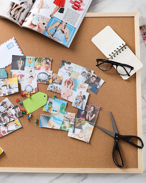 Flat lay composition with different photos, magazines and stationery on white marble backg