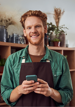 decorator boy smiling with a phone in his hand