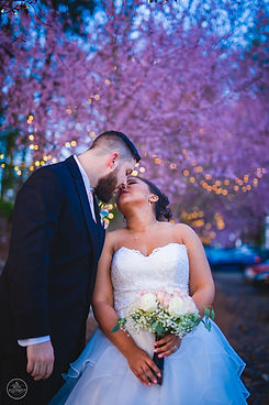 Wedding couple in front of Cherry trees