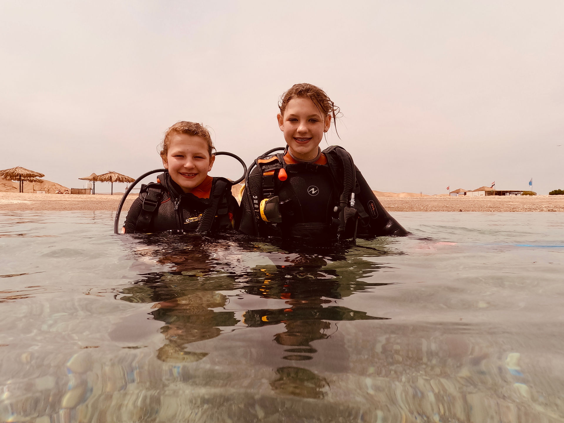 Bonita and Sirena Eade at the surface in Egypt wearing full scuba gear