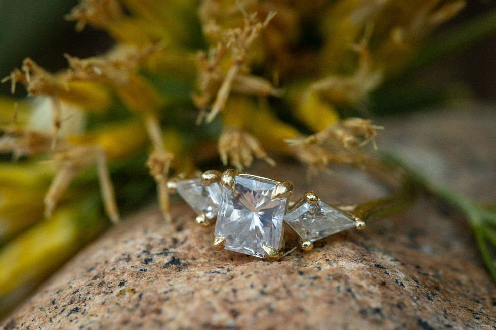 Engagement ring close-up placed on rock at Garden of the Gods