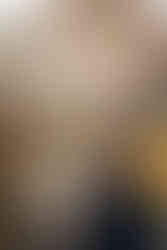 Kate and Matt walking hand in hand through red rock formations at Garden of the Gods