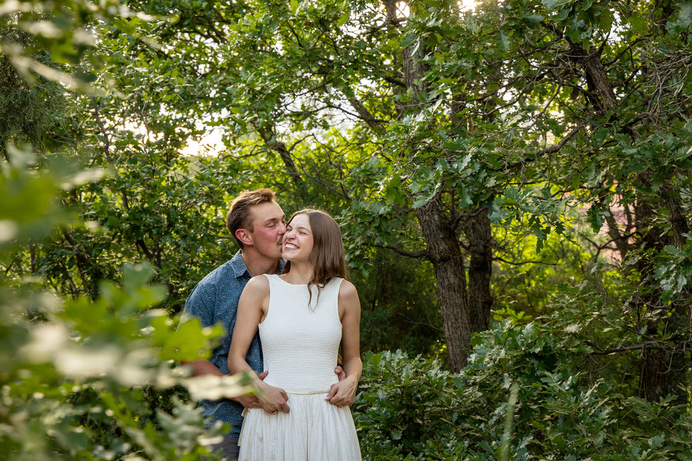 Couple engagement session in forest at Garden of the Gods