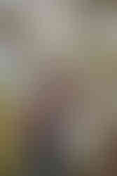 Couple framed by juniper tree branches during engagement shoot