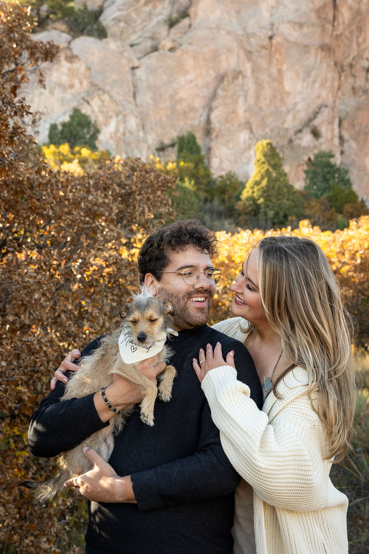 Kate and Matt laughing together surrounded by autumn colors in Colorado Springs
