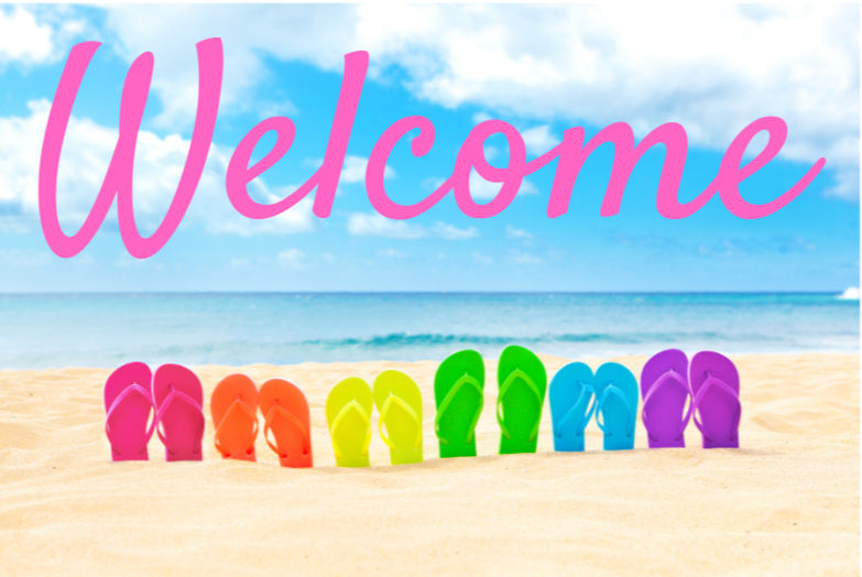 Colorful flip‑flops stuck upright in the sand with a welcome sign overhead, symbolizing warm greetings and beach travel inspiration at Epic Horizons Travel.