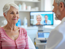 A dermatologist speaking with a patient