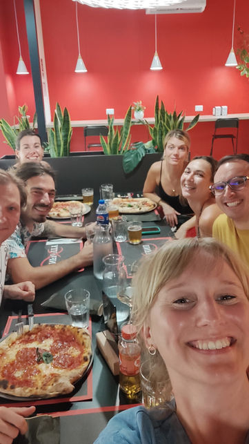 Eating pizza in Orte during a countryside coliving stay near Rome, Italy.