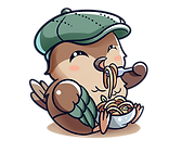 Nesto with a green hat eating pasta.