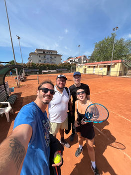 Nesting Away coliving guests playing tennis in the Italian countryside near Orte, Rome