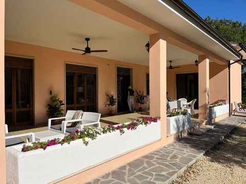 Main veranda seen from the garden at a coliving in Italy near Rome.