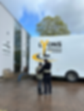 Lyons Removals and Stronge - Elizabeth and JOhn, Mum and Son with arms around each other l